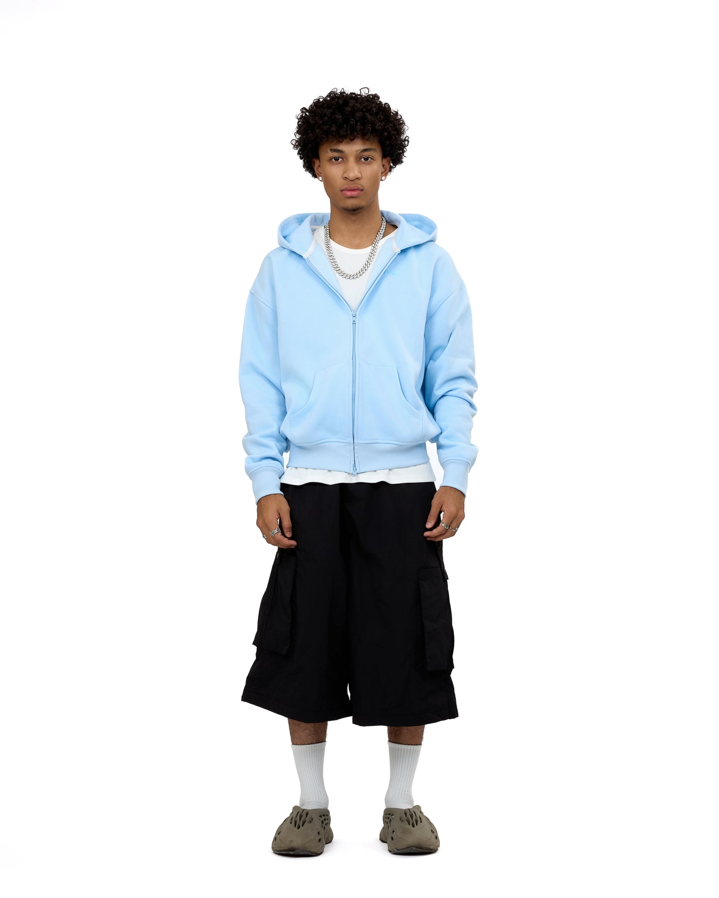 Front view of a male model wearing the LAVIEM Boxy Double-Zip Hoodie in white, highlighting the asymmetric dual zippers and oversized streetwear silhouette