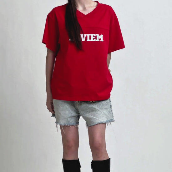 Person styling the LAVIEM Boxy Cropped T-Shirt with high-waisted jeans for a trendy streetwear look