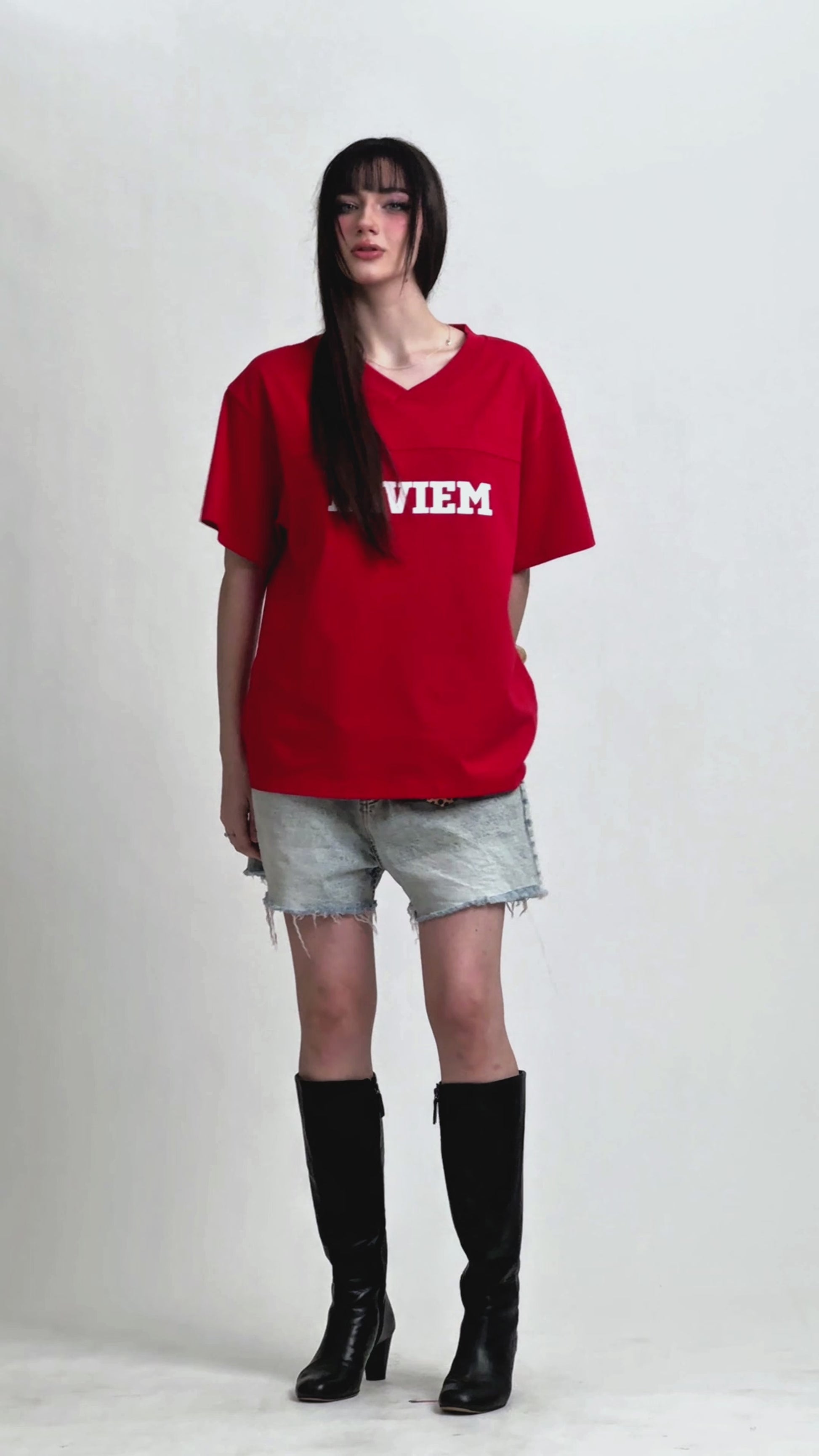 Person styling the LAVIEM Boxy Cropped T-Shirt with high-waisted jeans for a trendy streetwear look